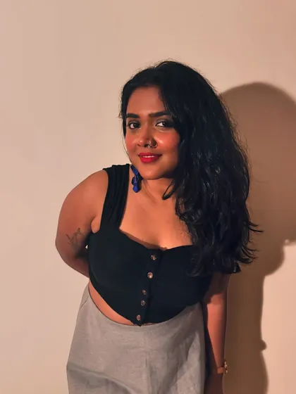 A smiling portrait from the same photoshoot.