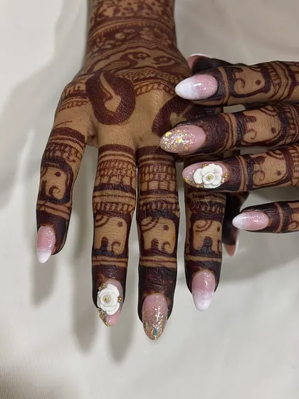 A close-up view of the 3D floral work and glitter accent nail. I pay close attention to every detail to ensure your wedding nails are flawless from every angle.