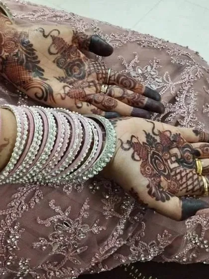 This is another example of the beautiful stain you can achieve with my organic henna, seen here with the bride's bangles. The deep color on the fingertips is a classic part of the bridal look.