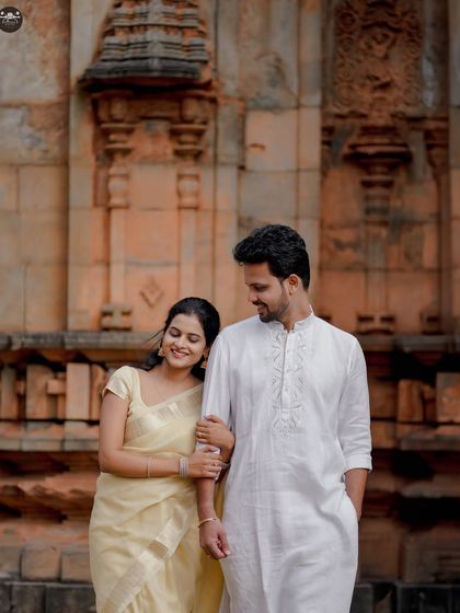 A sweet, candid walking shot of the couple at the heritage site. These unposed moments are often the most cherished.