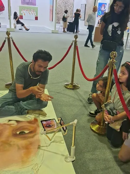 Here, guest artist Pramod Sahu captivates a group of young, aspiring artists with a live drawing demonstration. Our workshops for kids are designed to be engaging, educational, and inspiring.
