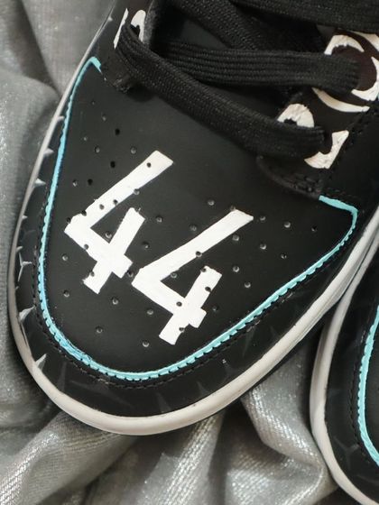 The final touch on the Mercedes F1 Dunks: Lewis Hamilton's iconic number 44 on the toe box. It's all about personalizing the design to celebrate your favorite driver and team.