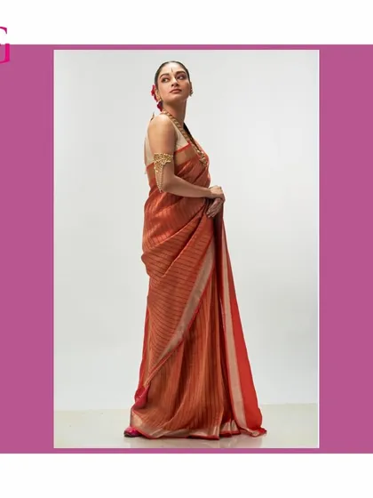 This vibrant orange silk linen saree makes a confident statement. The rich color and subtle texture are hallmarks of the Aadya collection's versatility.