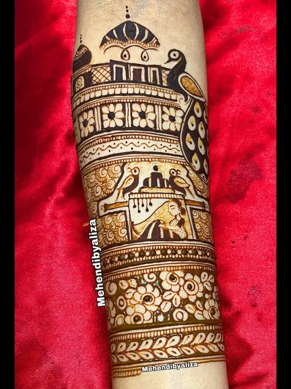 A close-up of the bridal arm startup, featuring a peacock and a palace, setting the stage for a royal theme.