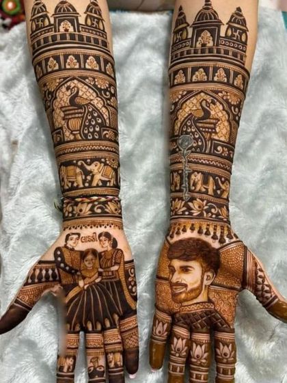 This personalized mehandi includes a portrait of the groom on one hand and a family portrait on the other, along with the bride's name.