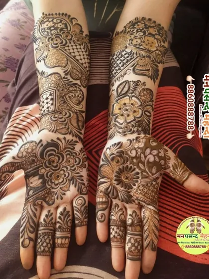 A beautiful floral design that is perfect for any celebration. The mix of bold flowers on the palm and intricate patterns on the arm creates a balanced and attractive look.
