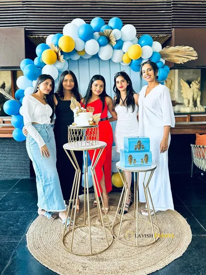 Friends gathering for a photo at the chic birthday celebration.