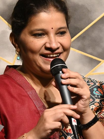 A student enjoying her moment at the microphone during one of our music events. We encourage every student to share their voice.