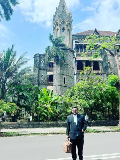Outside the historic Bombay High Court. My practice is not limited by geography; I am prepared to fight for my clients in any jurisdiction required.