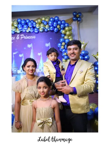 Here is a complete family set I designed for a birthday celebration. The parents and children are coordinated in a theme of gold and royal purple, with a custom gown for mom, a matching dress for the daughter, and smart blazers for dad and son.