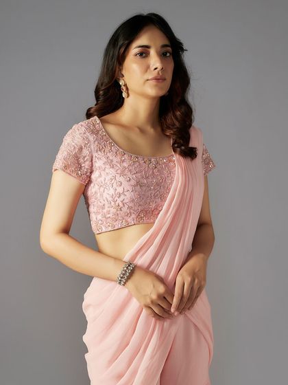 This extensive collection features a wide array of modern festive attire. From vibrant sharara sets and elegant anarkalis to chic jumpsuits and light lehengas, these pieces are curated for wedding guests and anyone looking for a stylish outfit for a special occasion.