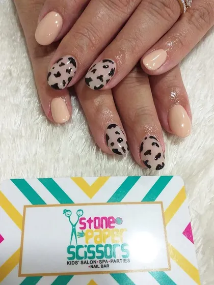 A chic and simple animal print design. I painted a classic leopard spot pattern on a few accent nails and kept the rest a solid nude color for a balanced, stylish manicure.