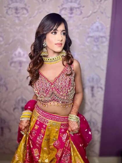 Another angle of this stunning Mehendi look, where the makeup enhances her features without competing with the outfit.