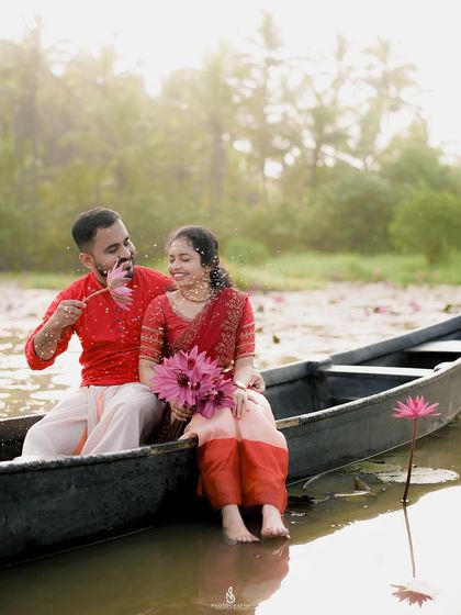 A sweet, playful moment with a single lotus flower. It's the small, spontaneous interactions that often make the best photos.