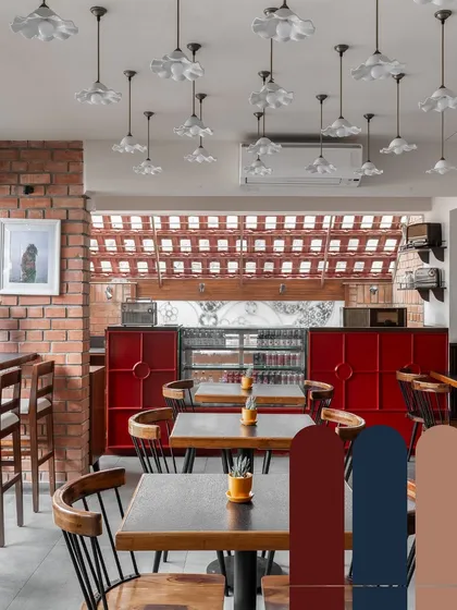 A color palette study for Klaa Kitchen. The combination of rustic brick, deep reds, and blues, along with warm wood tones, was chosen to create a mood of Goan nostalgia and warmth.