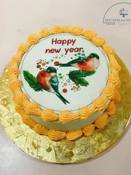 Ring in the New Year with this charming cake featuring a vintage-style print of two birds. A simple and sweet way to celebrate new beginnings.
