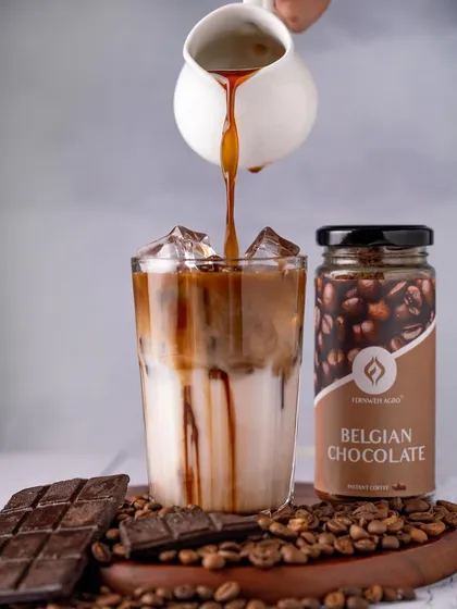 An action shot capturing the moment coffee is poured into a glass of iced milk. This dynamic image highlights the mixing of flavors and is a classic technique in beverage photography.