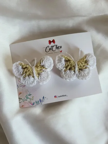 Elegant and delicate, these crochet butterfly clips have a touch of gold thread to make them shimmer.