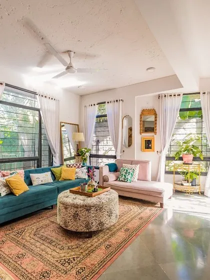 A sustainable home can also be vibrant and full of personality. This living room shows how we combine earthy materials like exposed brick with colorful, eclectic furniture and textiles to create a space that is both eco-friendly and deeply personal to its owners.