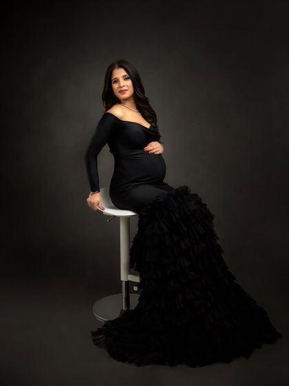 A touch of glamour in the studio. This mumma-to-be chose a stunning black mermaid gown from my client wardrobe, creating a sophisticated and dramatic maternity look.