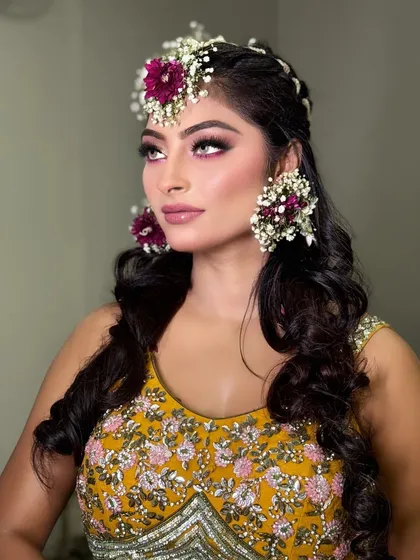A side profile showing the pop of colour on the eyes. This look is fresh, youthful, and perfect for a daytime Haldi ceremony.