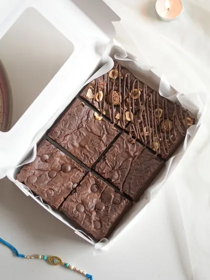 Another look at the assorted brownies, with a Rakhi placed beside the box to celebrate the occasion.
