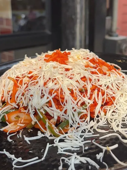 A mountain of my Cheese Chinese Bhel, loaded with cheese and flavour. It's the perfect snack to share with friends.