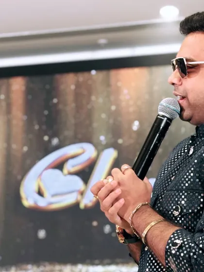 A close-up shot while speaking into the microphone. It shows the passion and focus I bring to my anchoring, ensuring every word connects with the audience.