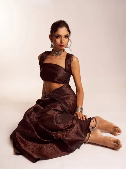 The full view of the modern-traditional look, showing how the styling, hair, and makeup come together to create a look that is both grounded and elegant.