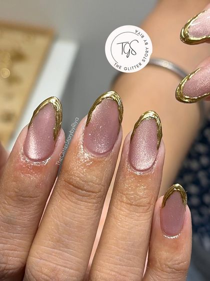 A close-up of a "gold-dipped" look, where I've created a thick, textured gold chrome border around a shimmery cat-eye base.