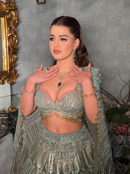 Rhinestones placed like angel wings for a heavenly look. This is for those who want all eyes on them. I paired the dazzling eyes with clean glass skin and a diffused liner.