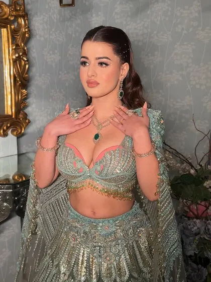 Rhinestones placed like angel wings for a heavenly look. This is for those who want all eyes on them. I paired the dazzling eyes with clean glass skin and a diffused liner.