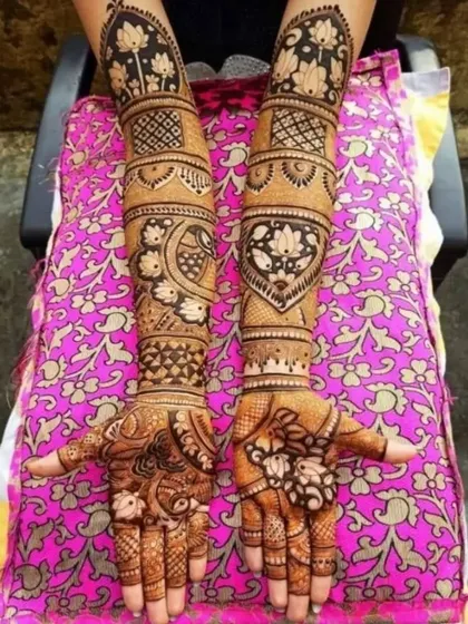 This design features beautiful lotus and peacock motifs. The patterns are arranged in neat bands up the arm, creating a very clean, symmetrical, and traditional look.