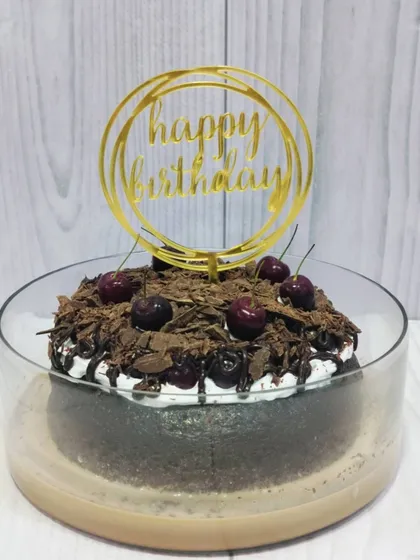 I can add custom toppers to any of my Tres Leches cakes for special occasions, like this "Happy Birthday" topper on my Black Forest Tres Leches.