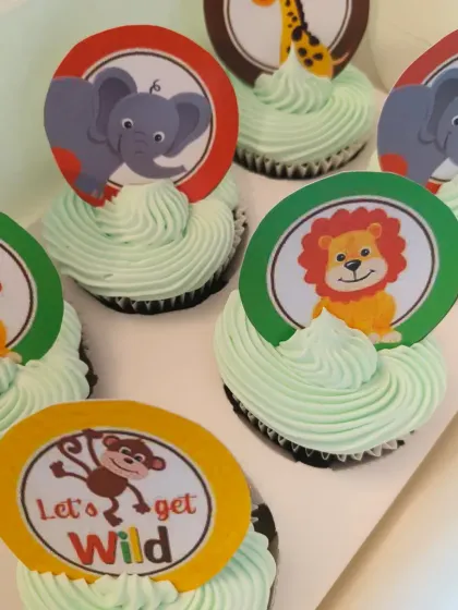 "Let's get wild!" These jungle animal themed cupcakes are perfect for a safari or zoo-themed party. Each cupcake features a different animal topper like a lion, elephant, or monkey.