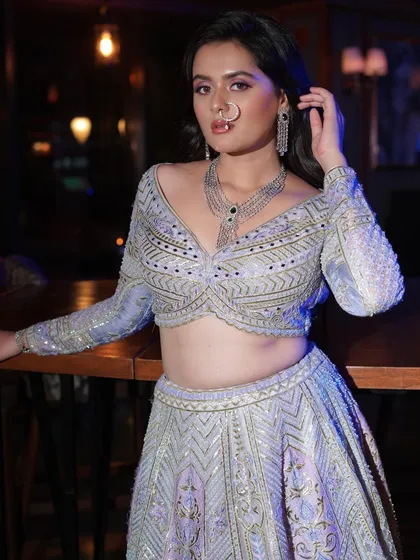 A final shot of this stunning reception look, showing how the makeup, hair, and outfit create a cohesive and unforgettable image.