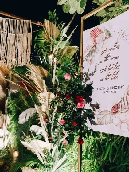 The welcome sign for the boho Sangeet, framed with pampas grass and macrame, perfectly introducing the theme of the evening.