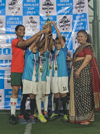 Our Under-10 girls and boys team celebrating their victory at the Inter Goalazo Cup.