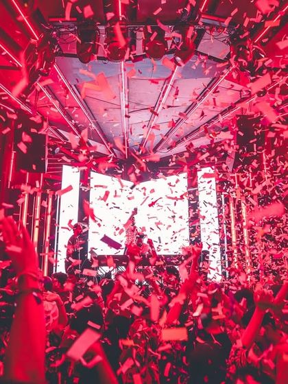 Red lights and a storm of confetti create a visually stunning moment at FLO Church Street. Every detail is curated for maximum impact.