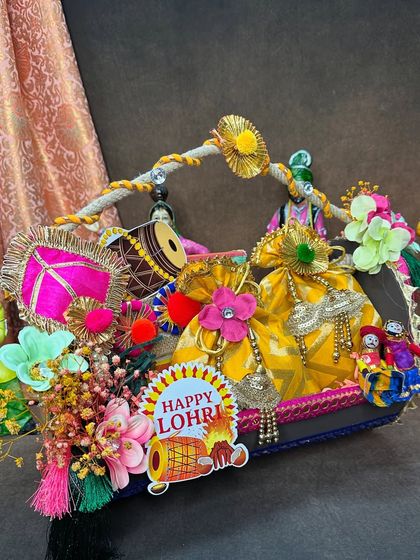 Another look at our dhol-shaped Lohri hamper. The vibrant colors, textures, and traditional elements come together to create a gift that is both beautiful and full of festive spirit.