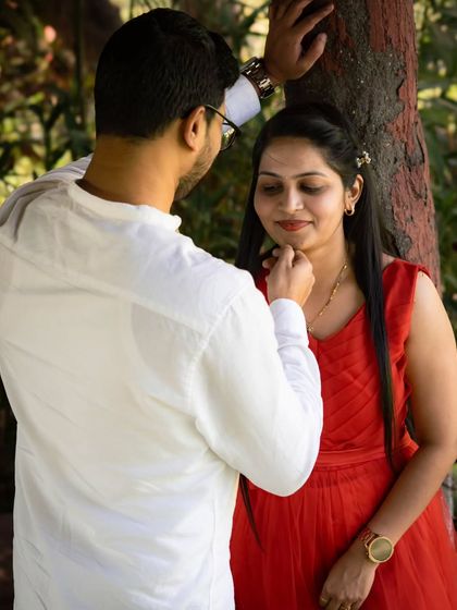 A tender moment captured during a post-wedding shoot. The soft, natural light and the gentle touch create a feeling of warmth and intimacy.