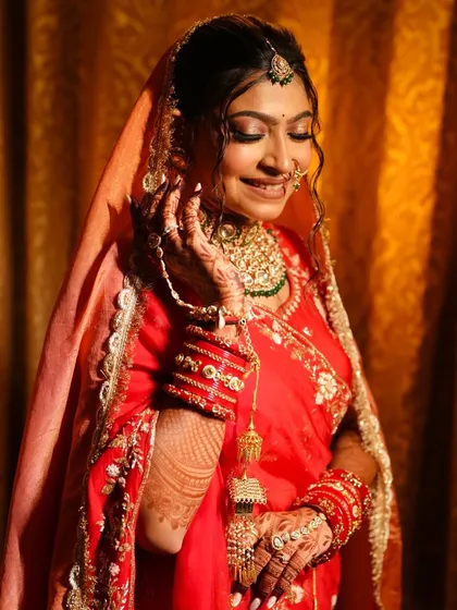 A beautiful three-quarter shot of the bride, her veil softly framing her face.