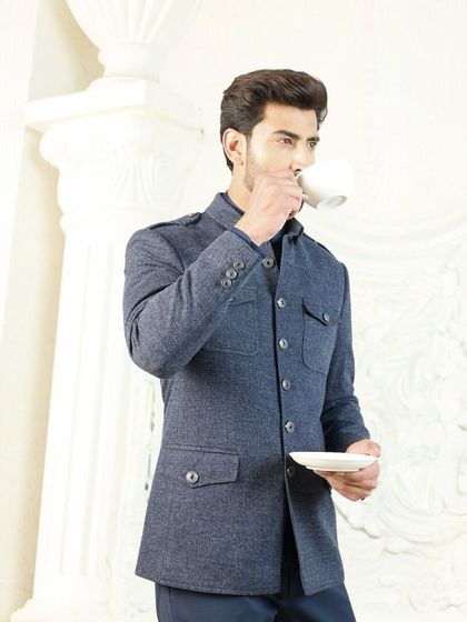 A moment of quiet contemplation in the navy co-ord set. This luxurious linen ensemble is the perfect choice for a summer wedding or a sophisticated daytime event.