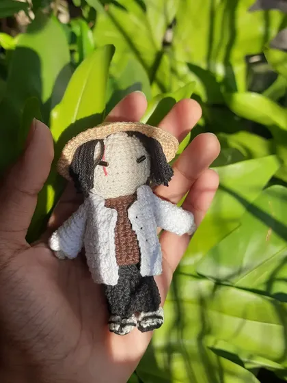 Holding the Yoongi doll gives a sense of its size. It's a perfect handheld buddy, great for displaying on a shelf or desk as part of a BTS collection.