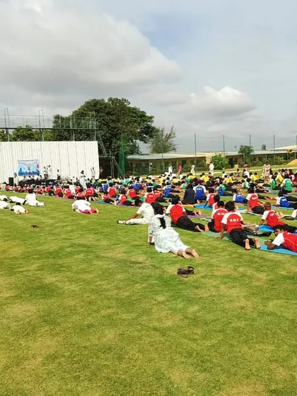 A wide angle of our mass yoga session, demonstrating our commitment to the mental and physical well-being of our athletes.