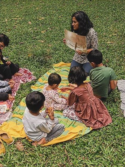 A series of photos from our 'Courage' themed session, showing different angles of the group and the beautiful, leafy surroundings of our storytelling spot.
