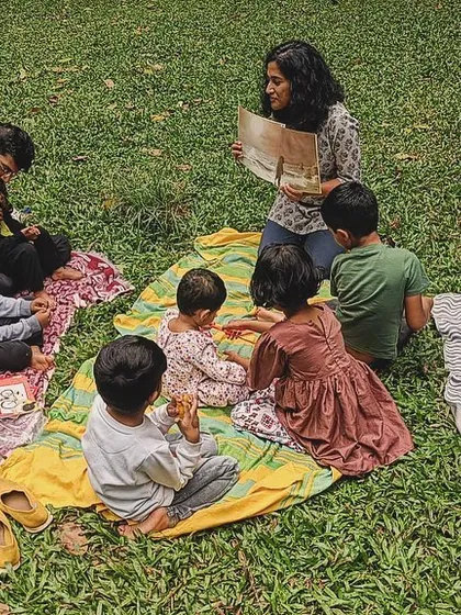 A series of photos from our 'Courage' themed session, showing different angles of the group and the beautiful, leafy surroundings of our storytelling spot.