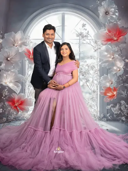 A classic seated portrait of the couple in our winter wonderland setup. The husband's embrace shows love and support.
