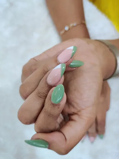 A full view of the pastel green set, showing the combination of solid color and abstract French tips.