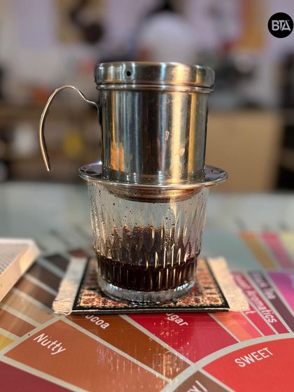 The Vietnamese Phin filter, ready for brewing. It's a simple, effective tool for making a strong and flavorful cup.